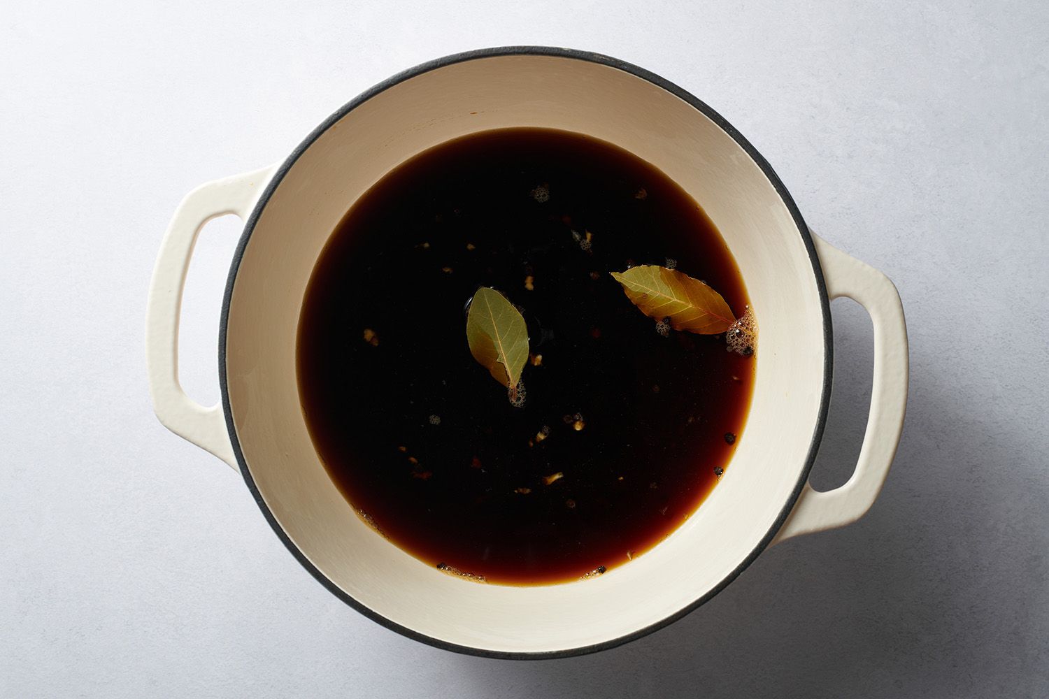 stock pot with soy sauce, water and seasonings