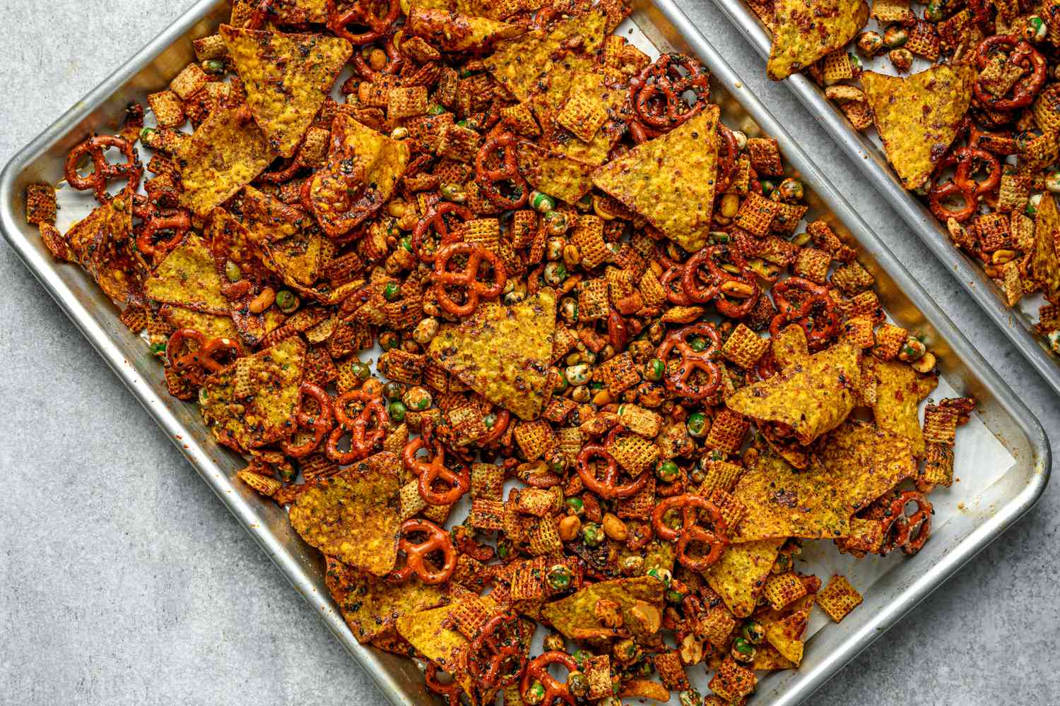 browned and baked furikake chex mix on two sheet trays