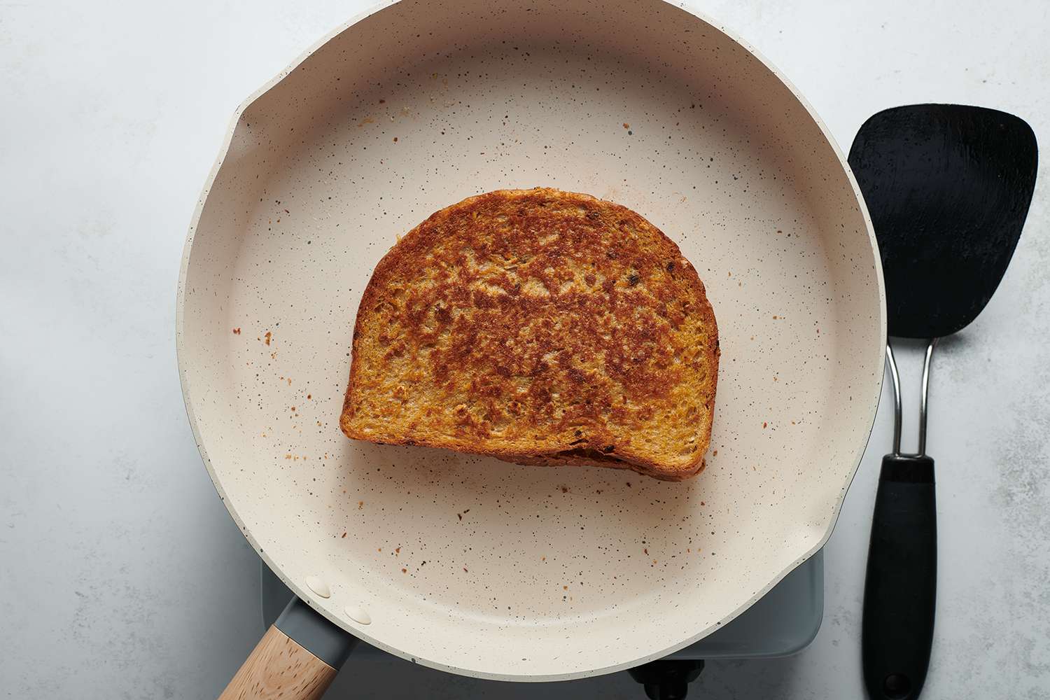 grilled cheese sandwich cooking in a skillet