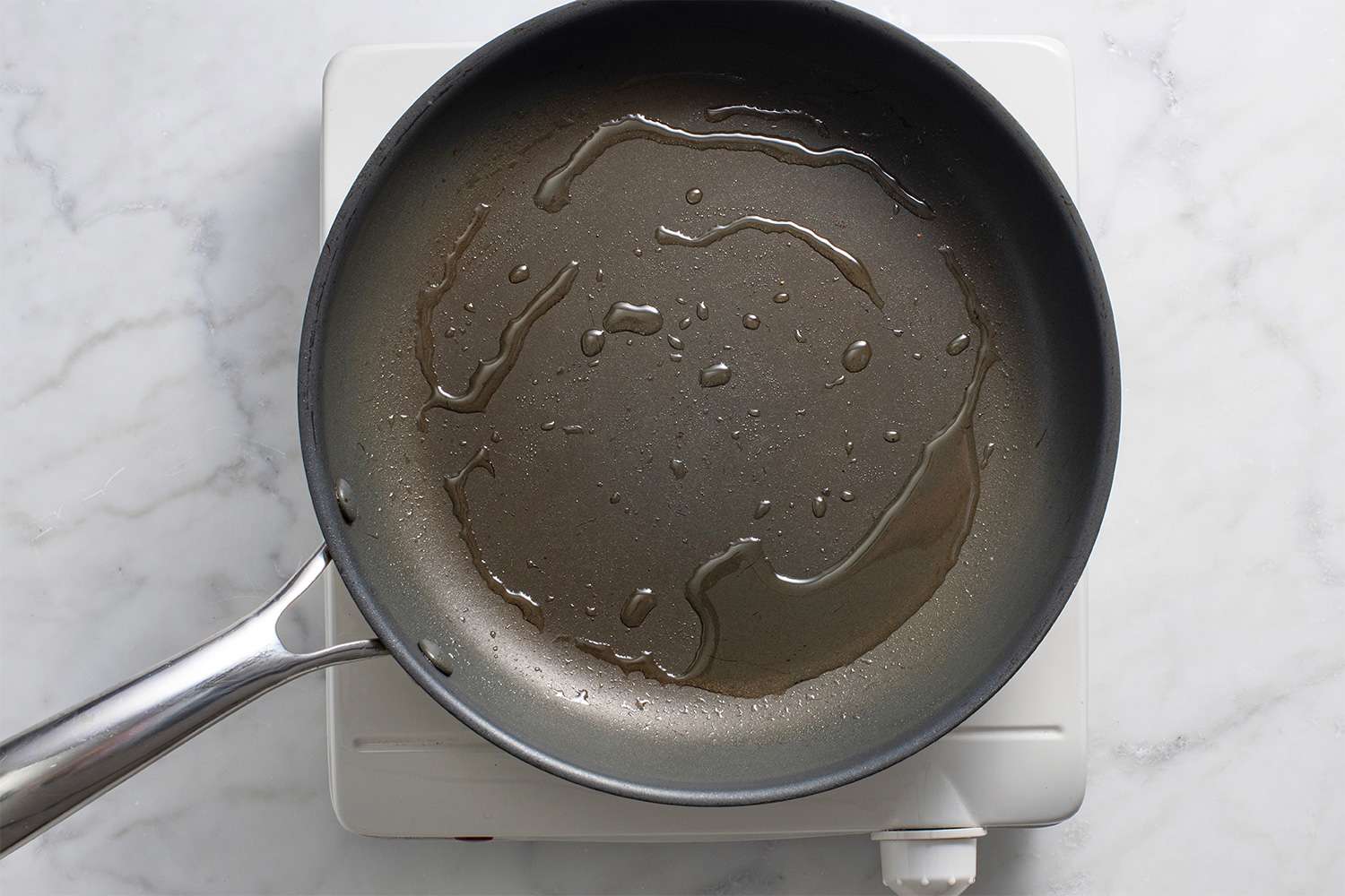 Oil in a pan on a burner 