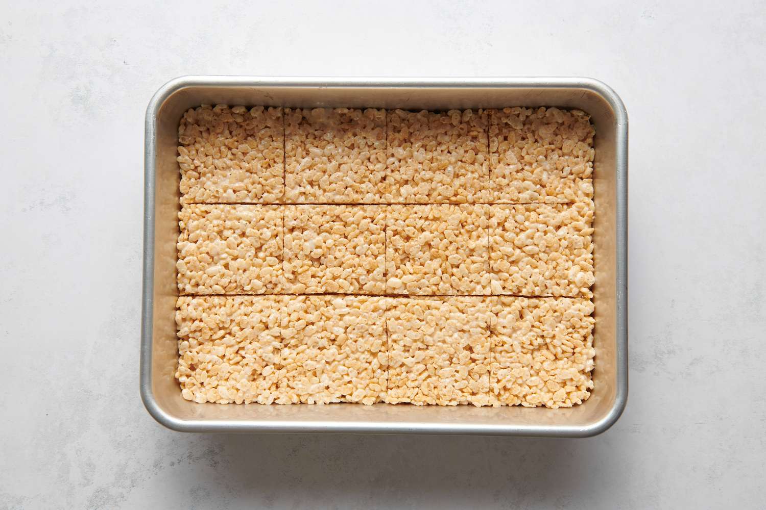 A 9 x 13 baking pan of rice crispy treats cut into squares