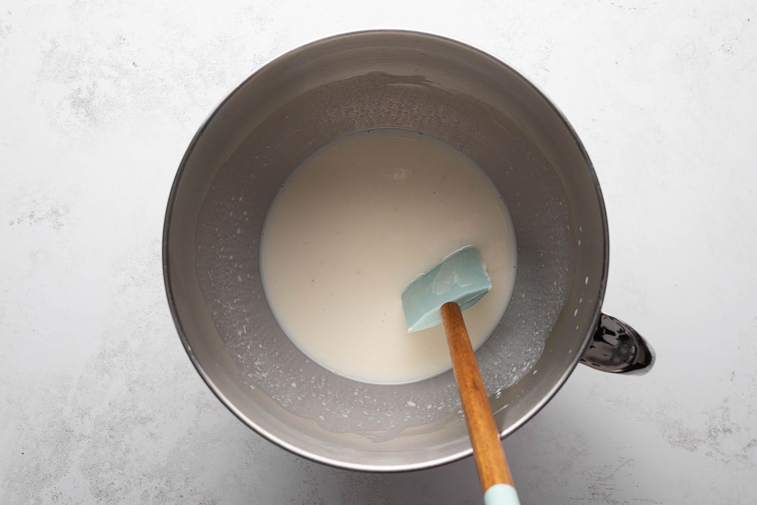 Stand mixer bowl with milk mixture