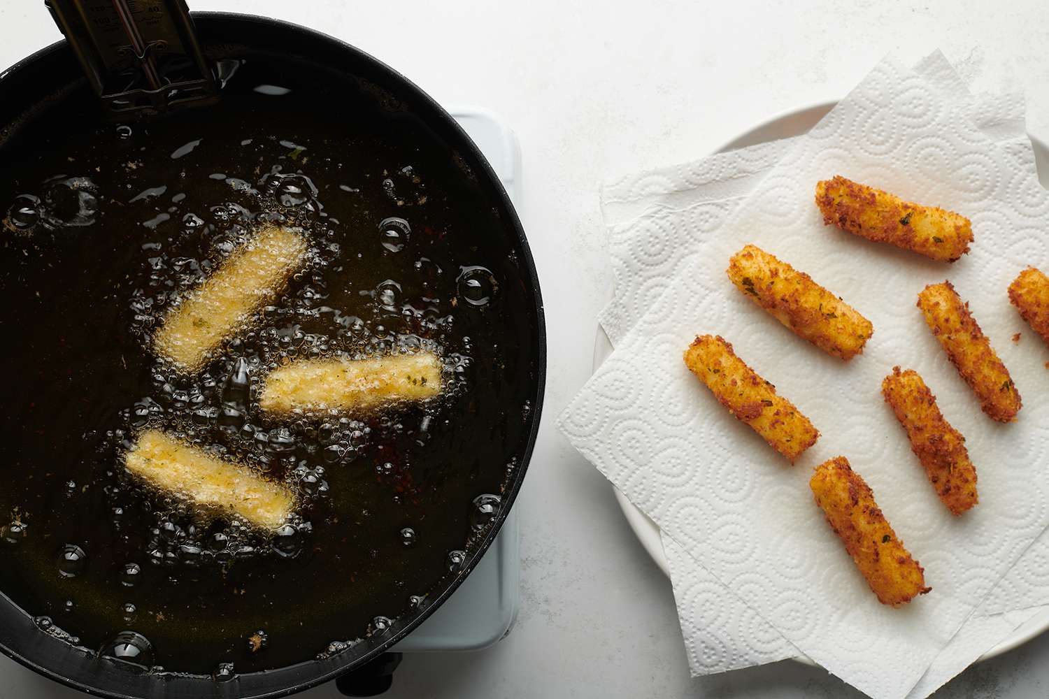 mozzarella sticks frying in oil