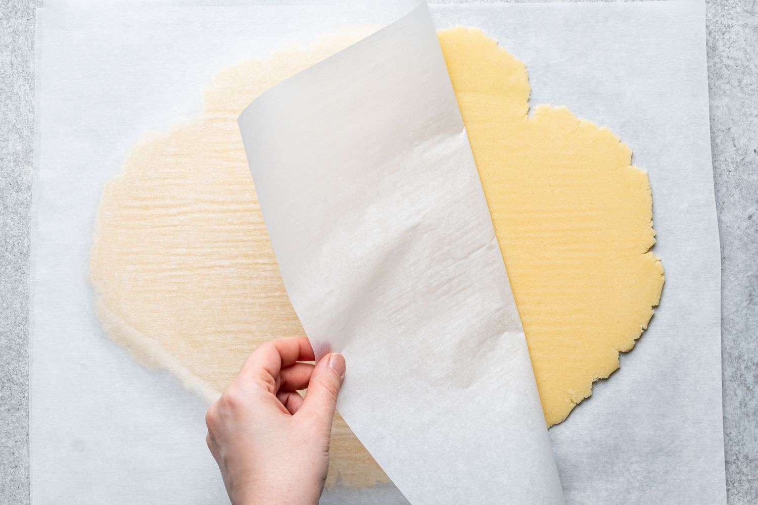 Peeling back parchment paper from the craquelin