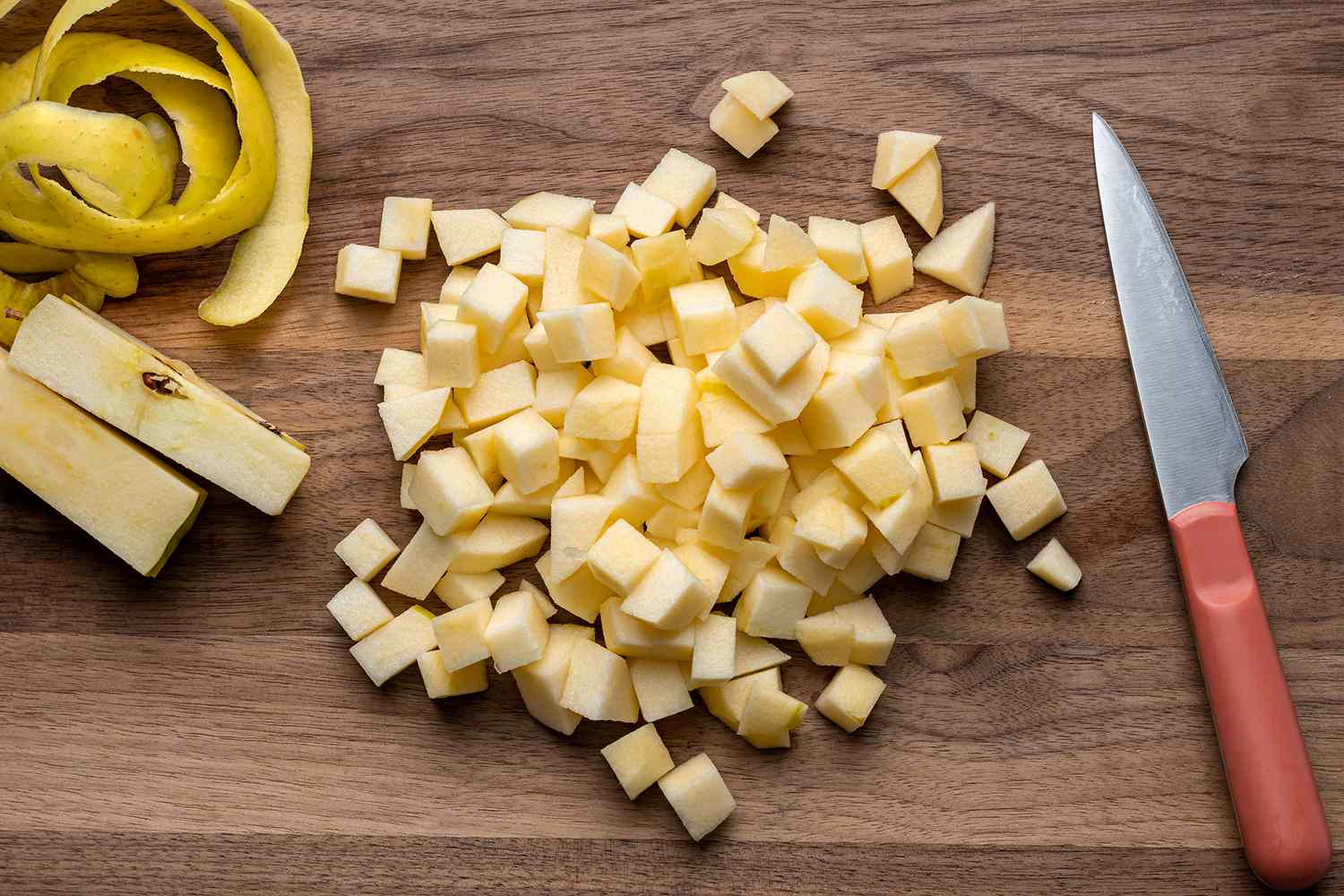chopped cubed apples on a cutting board