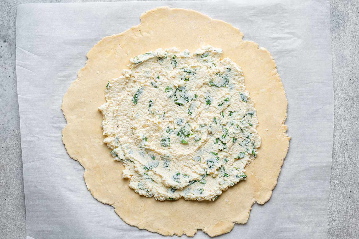 pastry dough with herb, cheese spread