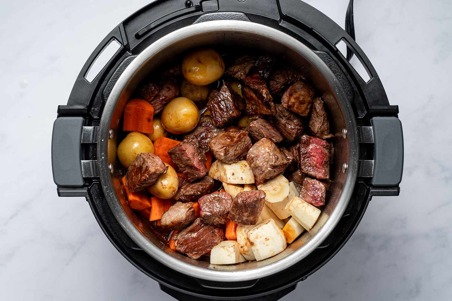 beef stew cooking in an instant pot
