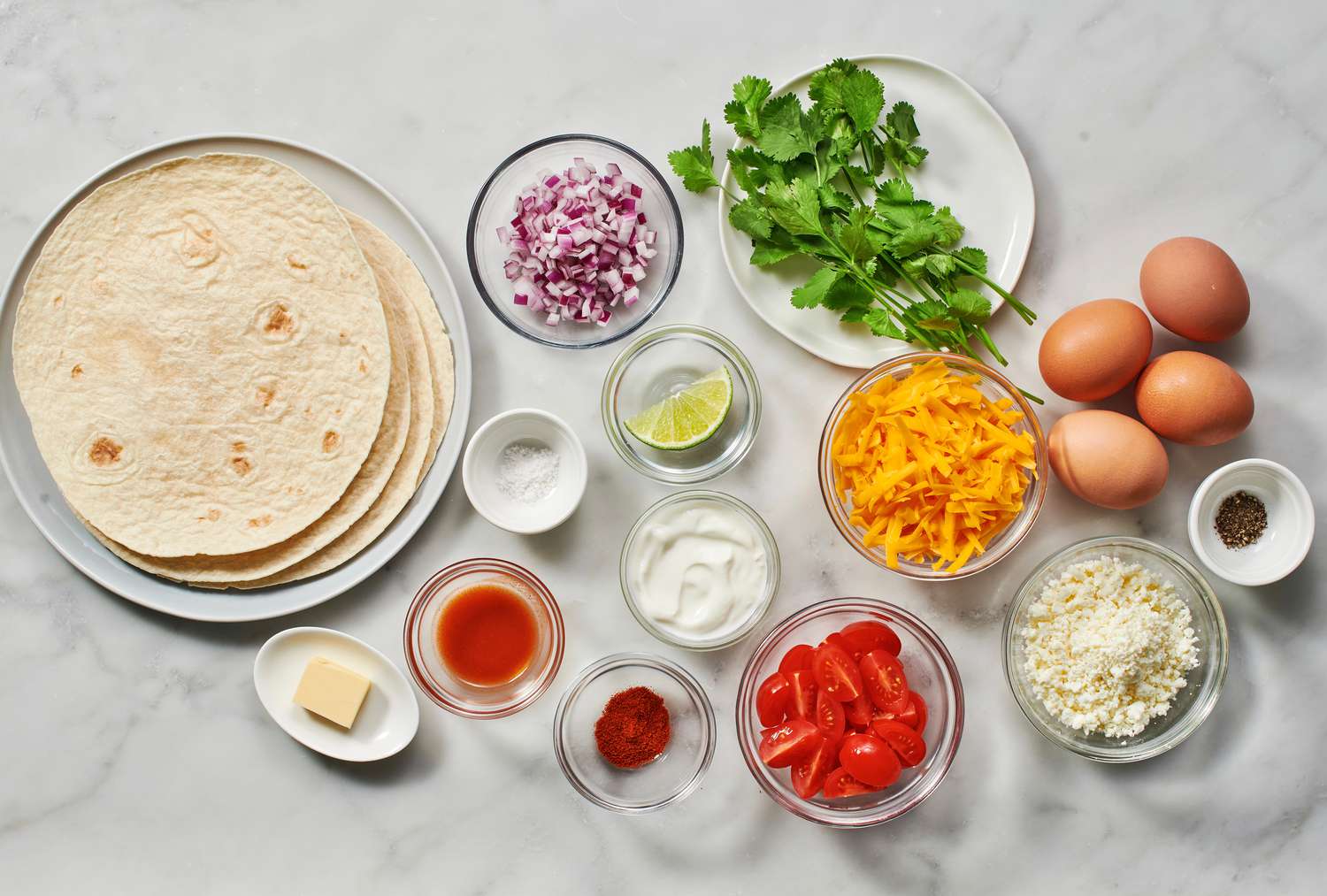 Ingredients to make quesadilla breakfast tacos