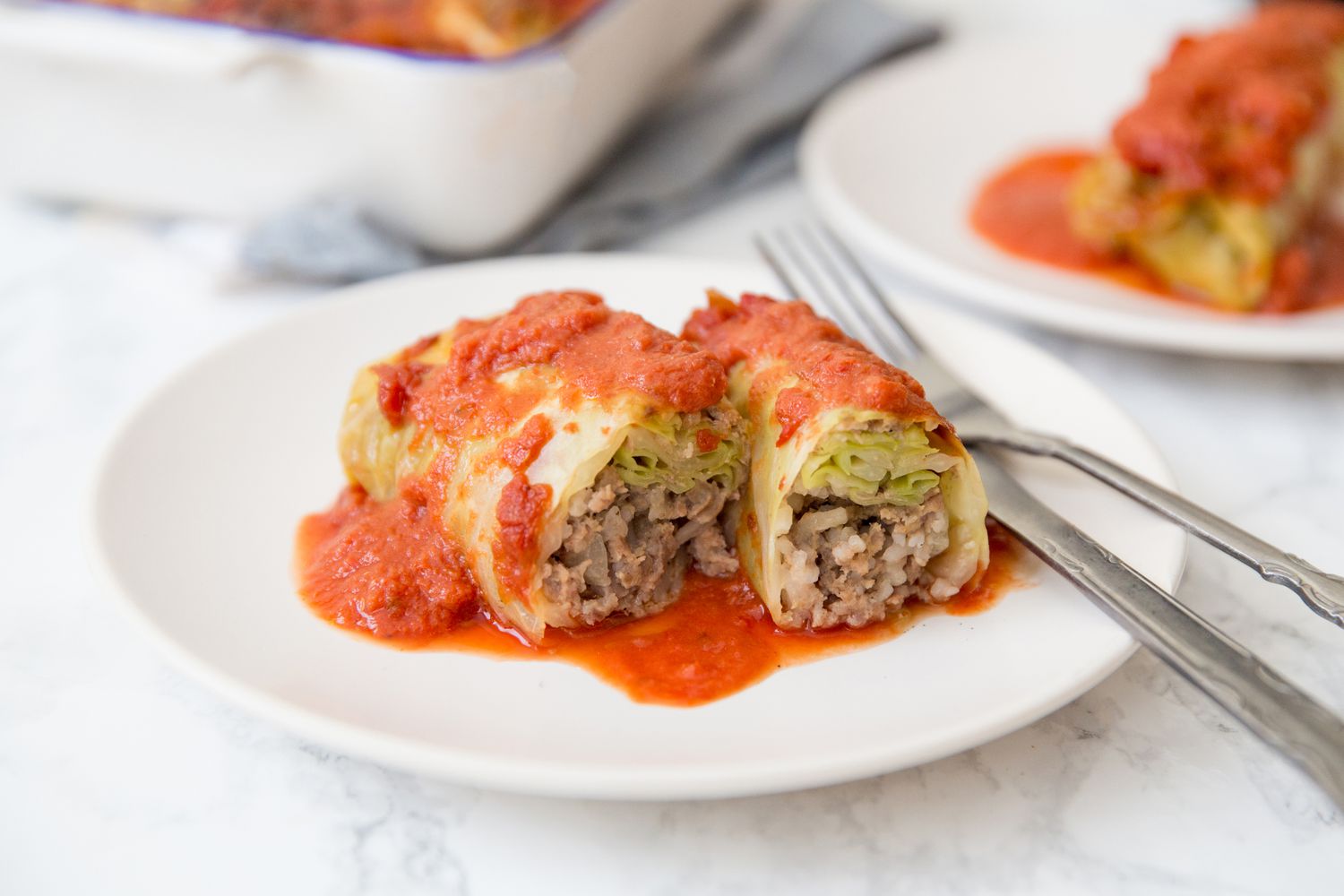 Stuffed cabbage rolls with ground beef and rice on a plate