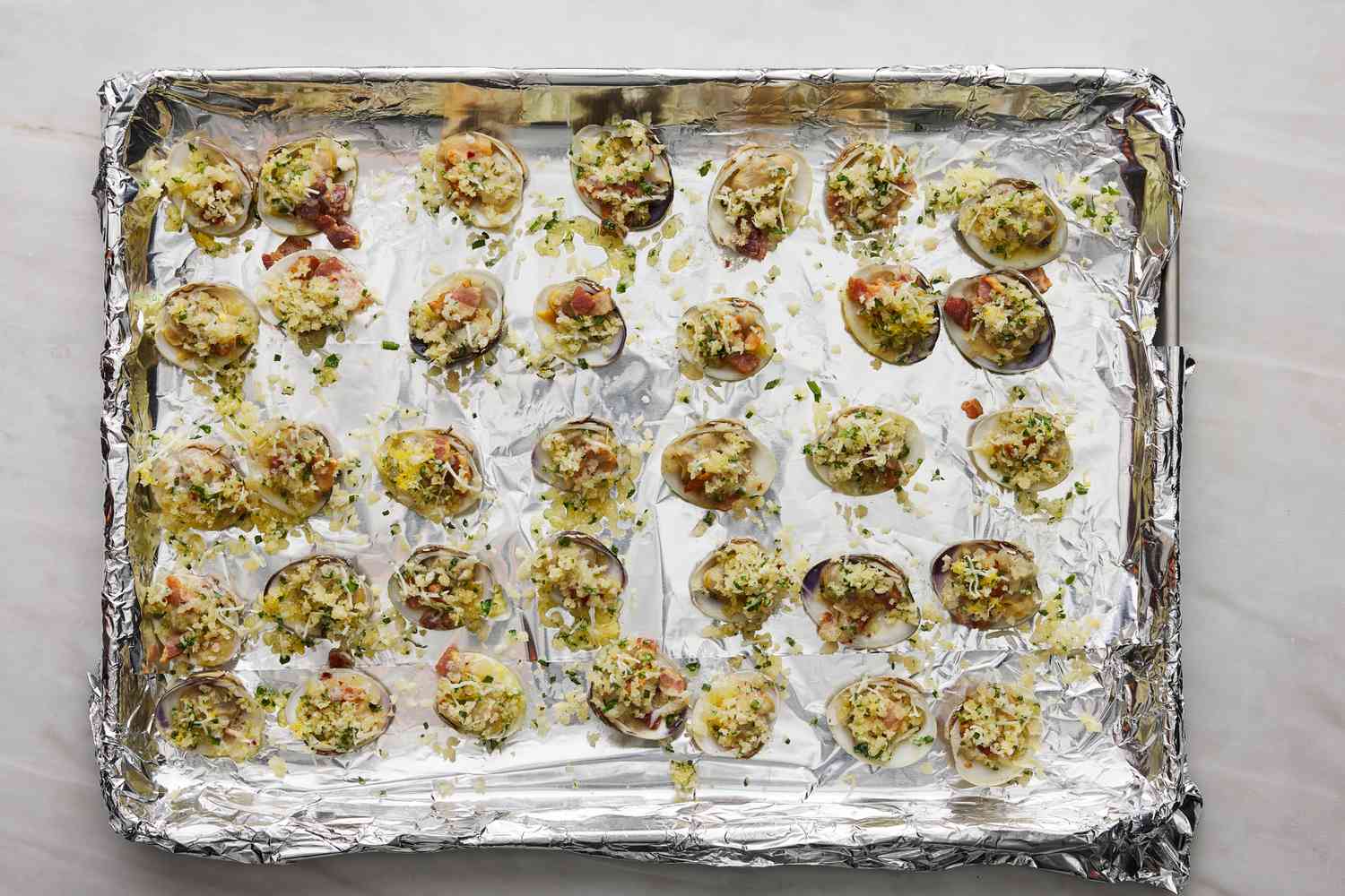 baked clams casino on baking sheet