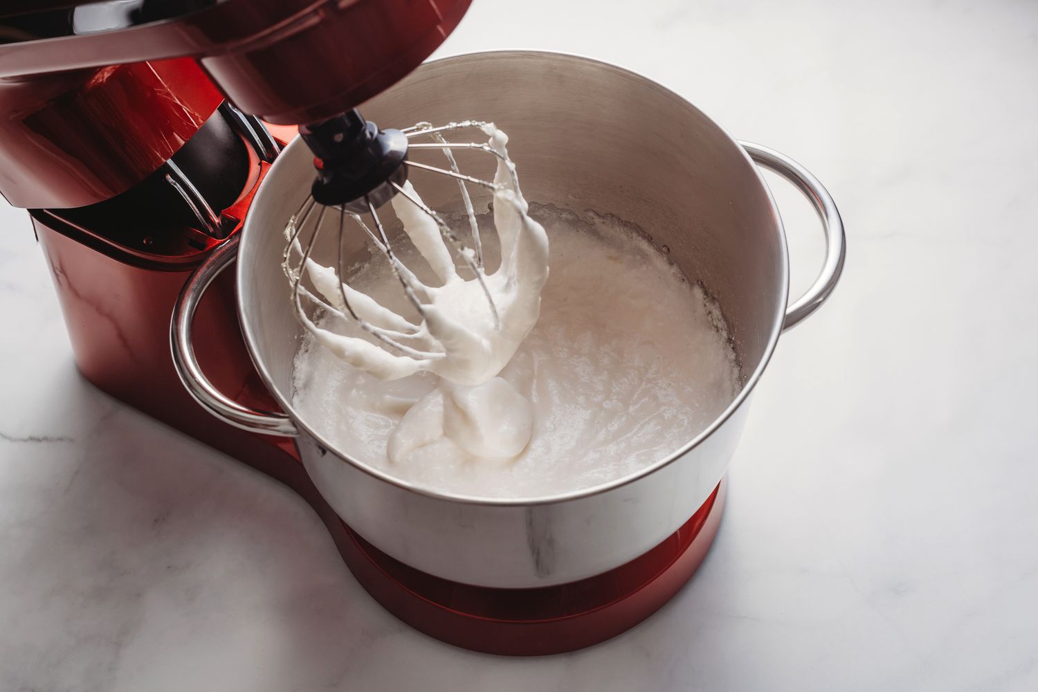 Glossy stiff egg white mixture in the stand mixer 