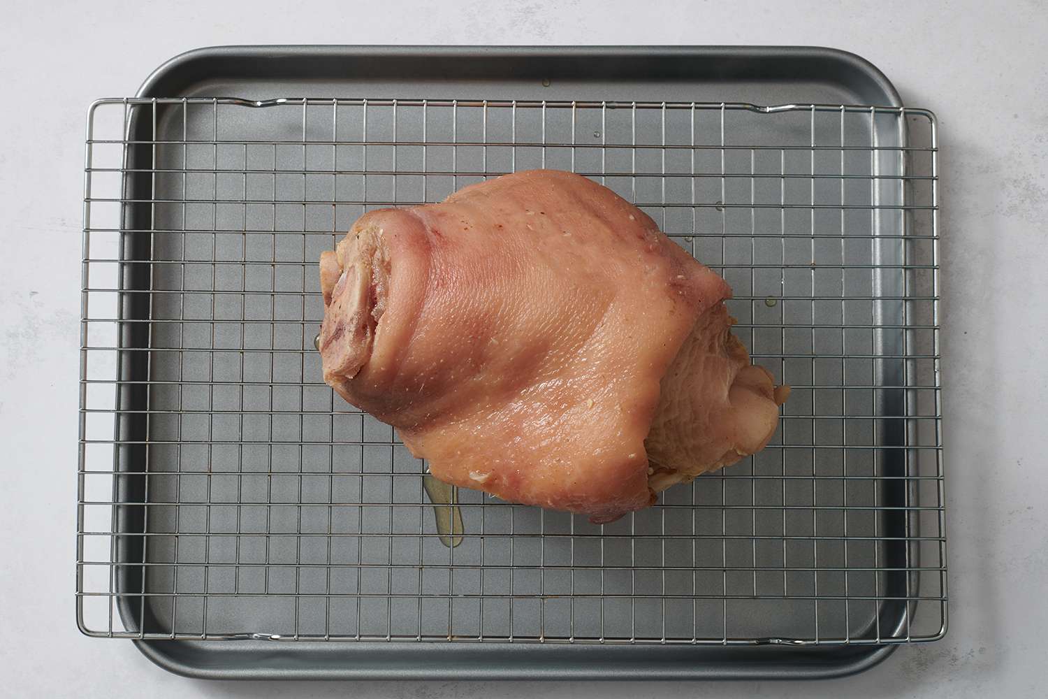 Boiled ham hock on a cooling rack