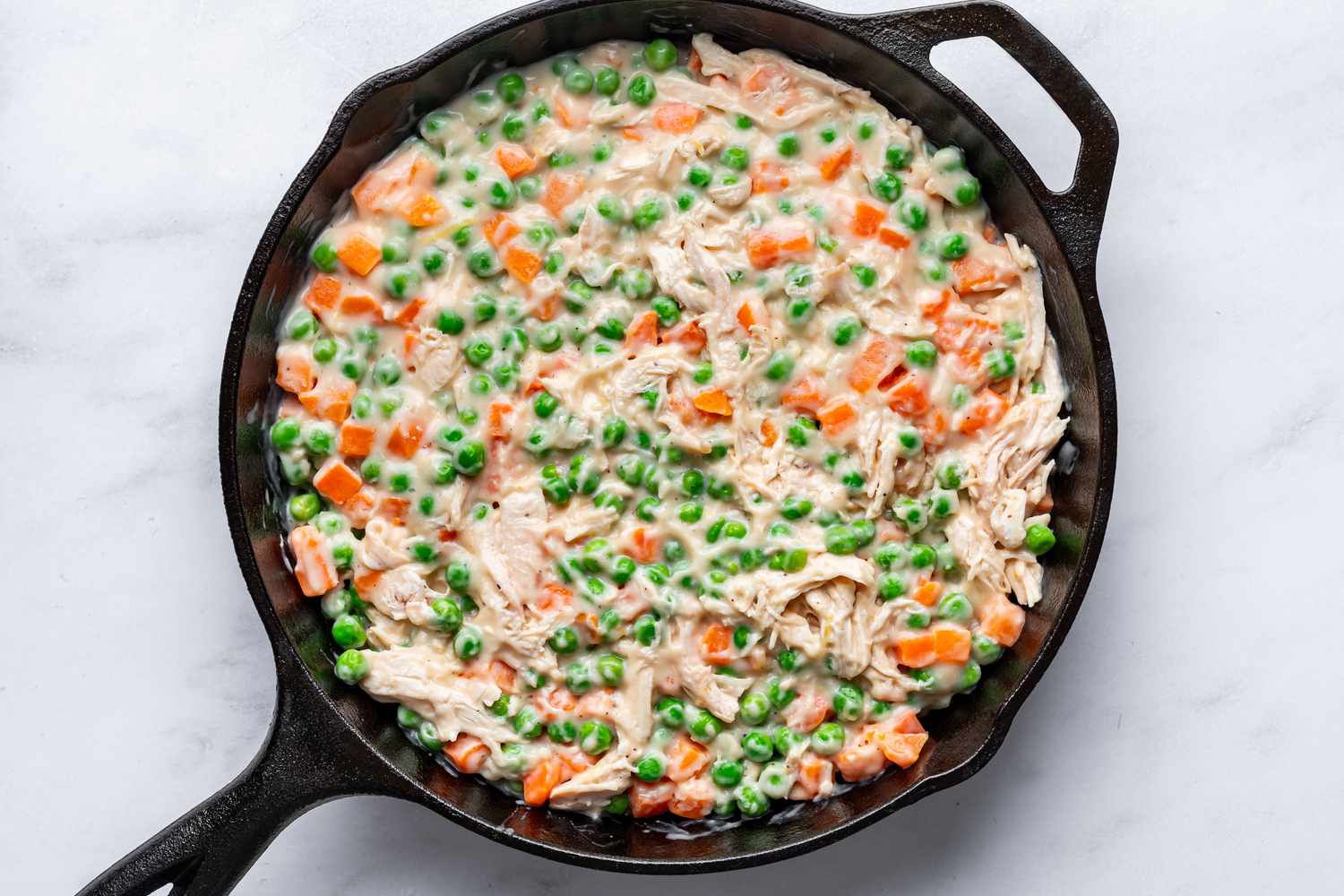 Chicken mixture added to a large skillet