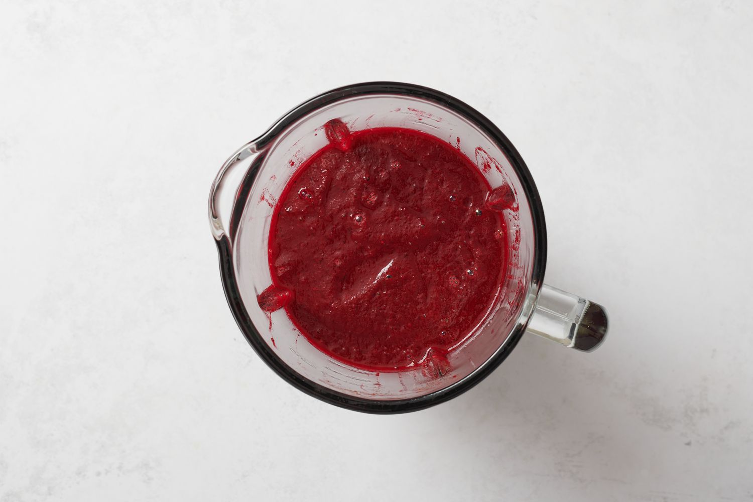 A blender with beets, tomato juice, dill, lemon juice, Worcestershire sauce, horseradish, lemon pepper, and garlic