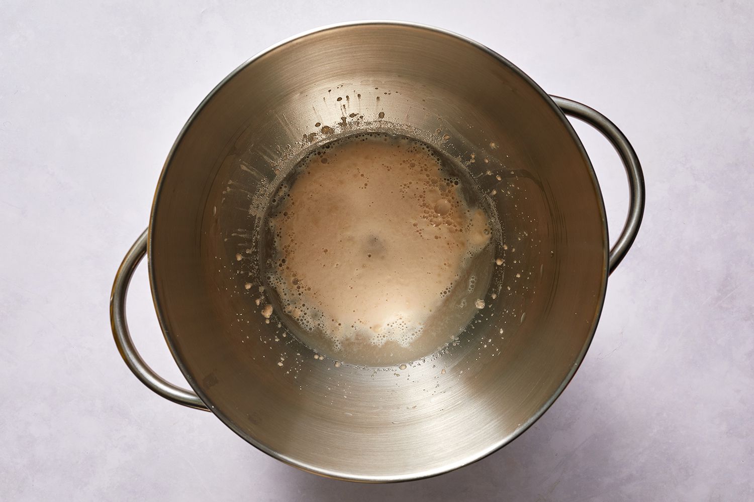 Honey, water and yeast in a bowl 