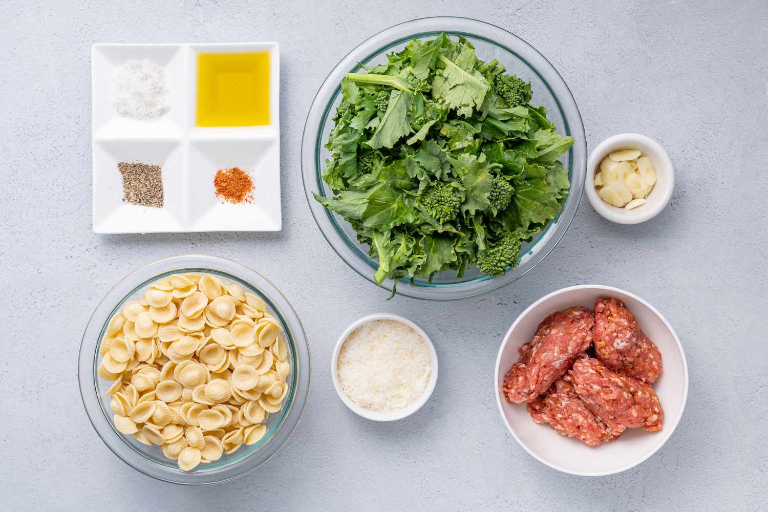 Ingredients to make orecchiette with sausage and broccoli rabe