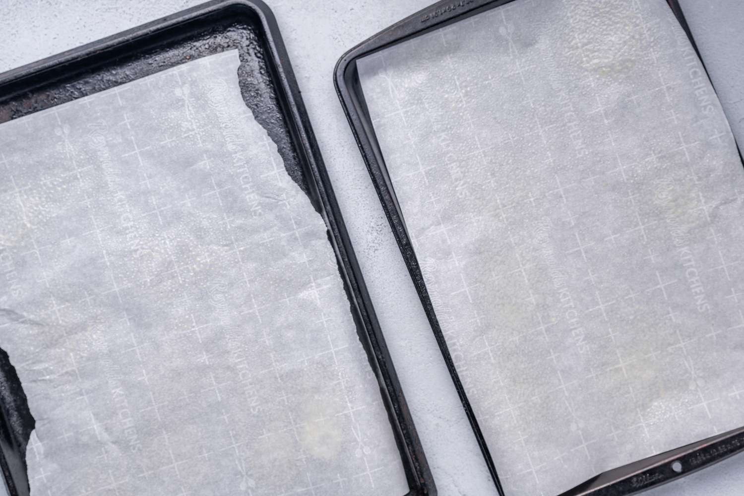 Two baking sheets lines with greased parchment paper
