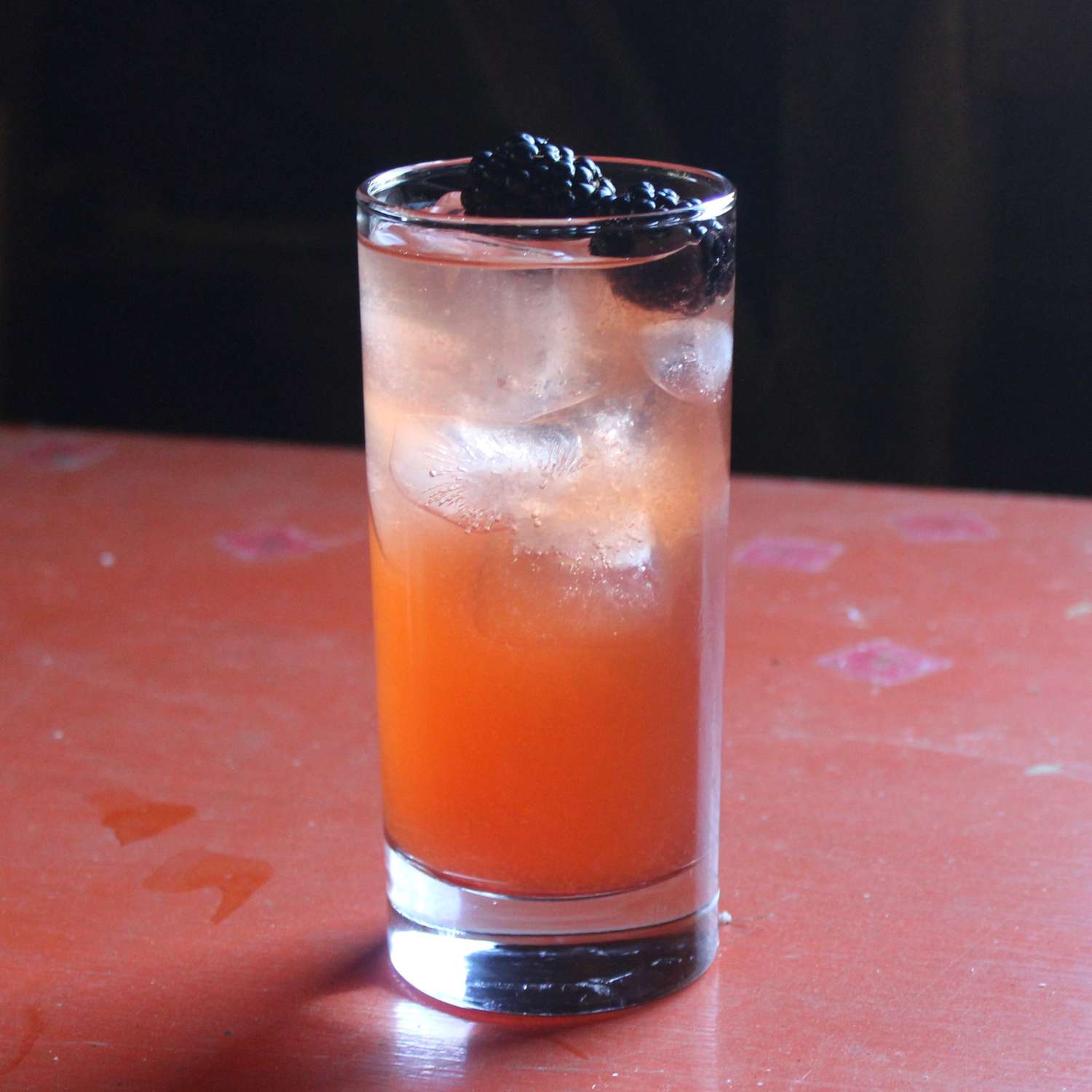 Rum Runner Cocktail with blackberry garnish