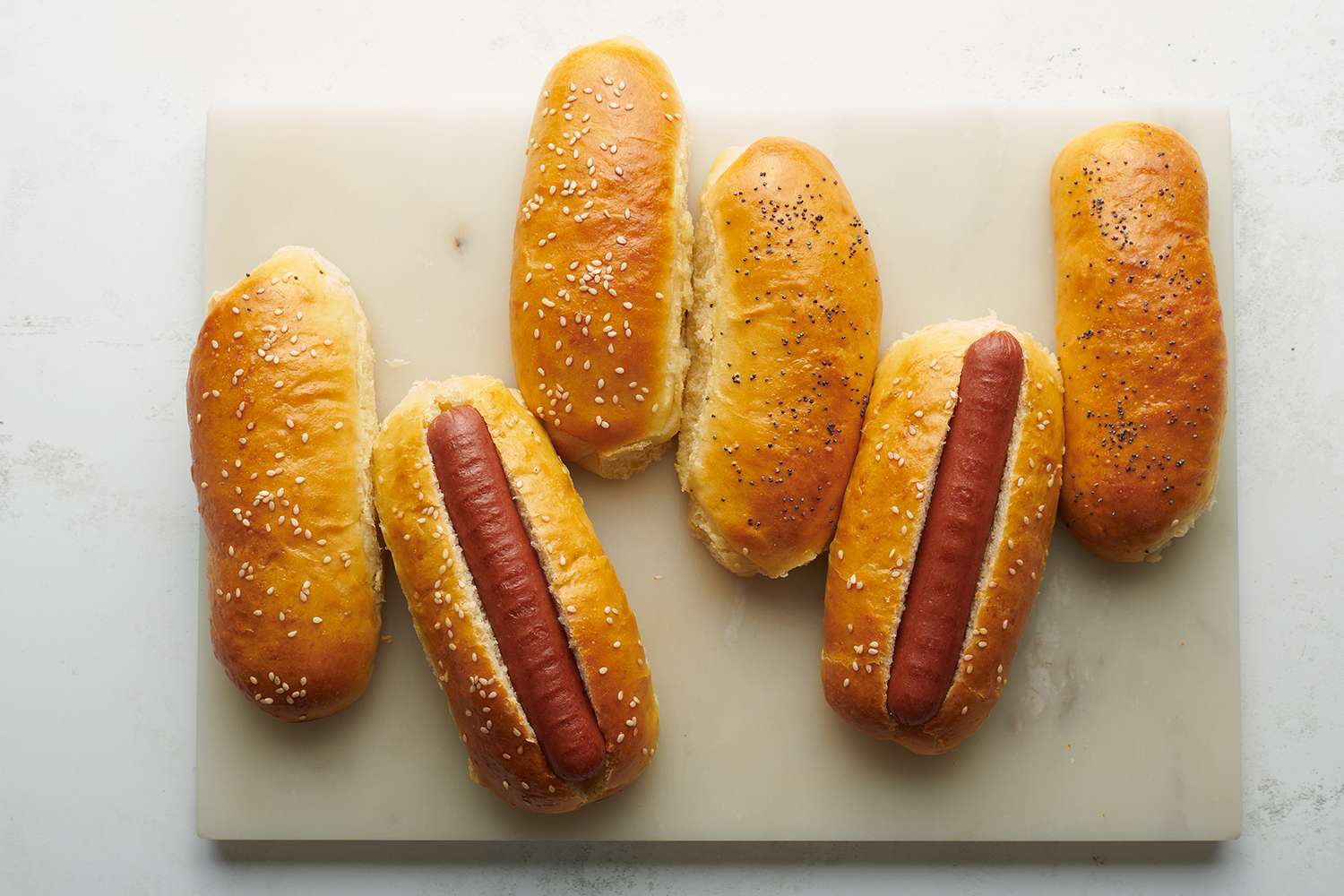 Hot dog buns and hot dogs 
