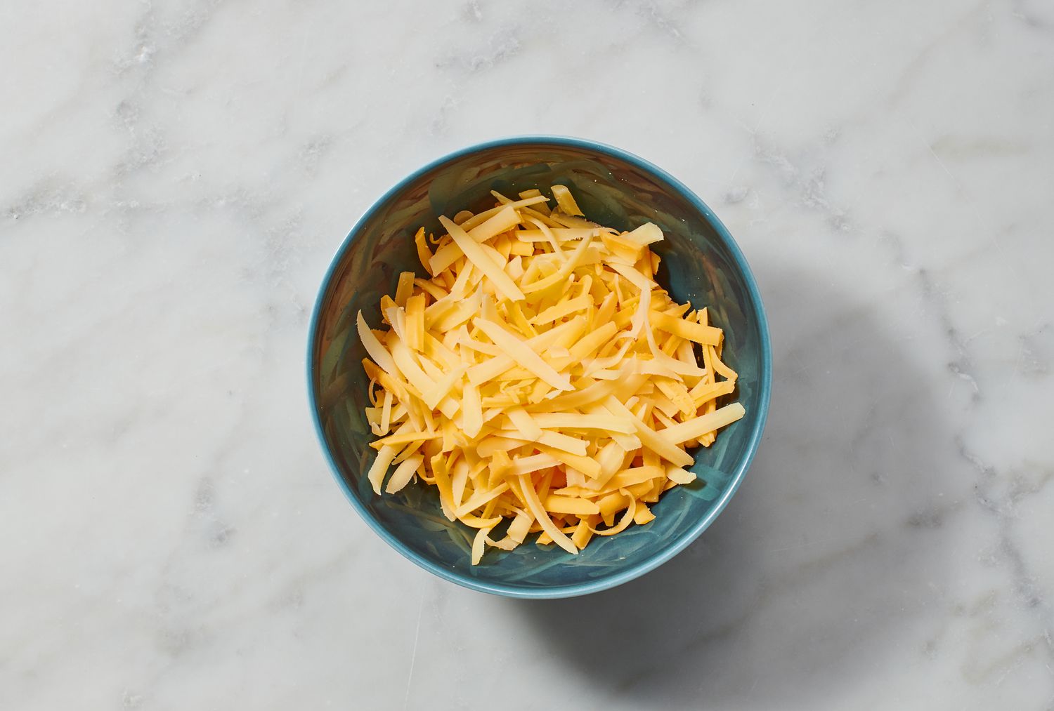 A small bowl of shredded cheese