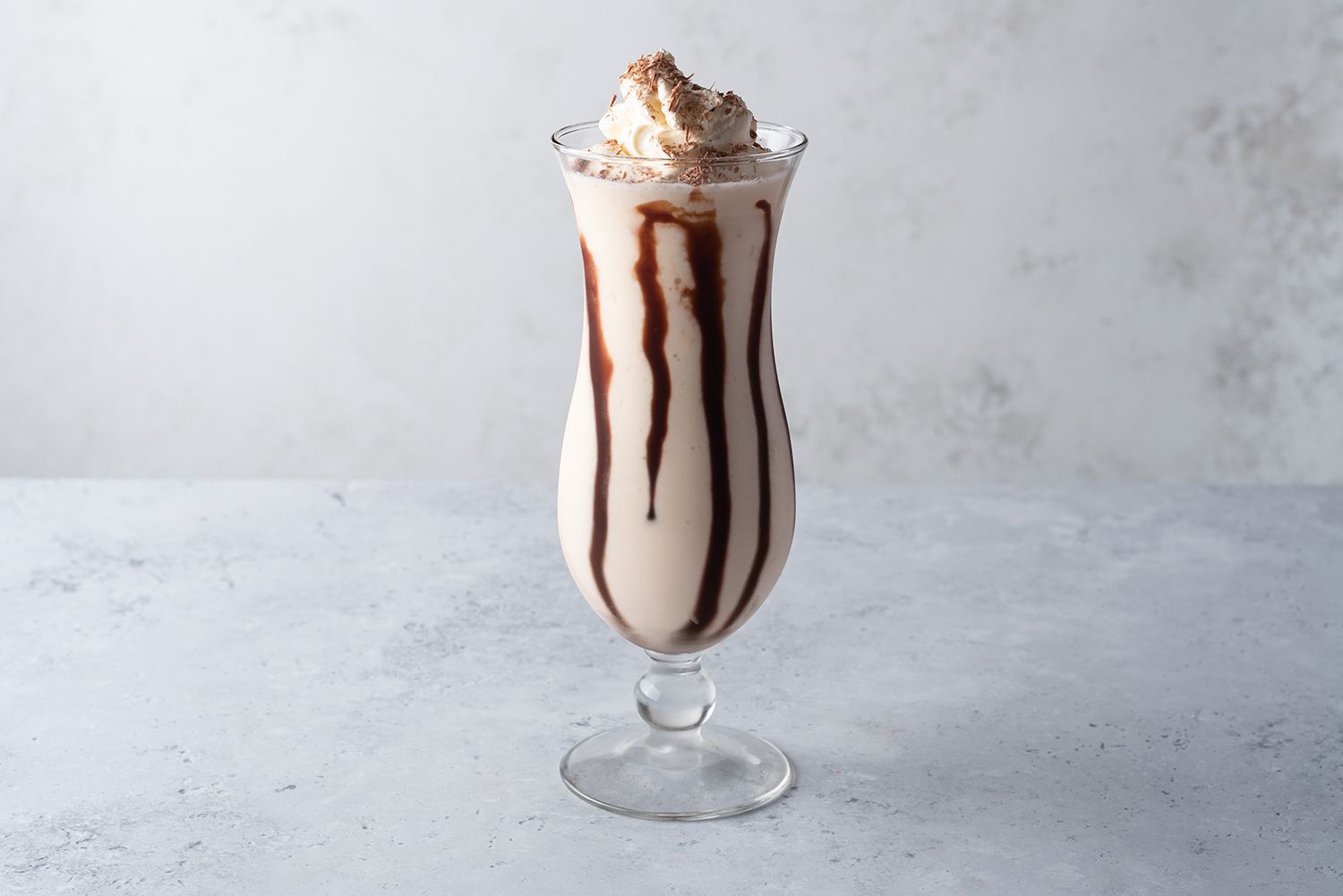 Frozen Mudslide garnished with whipped cream and grated chocolate