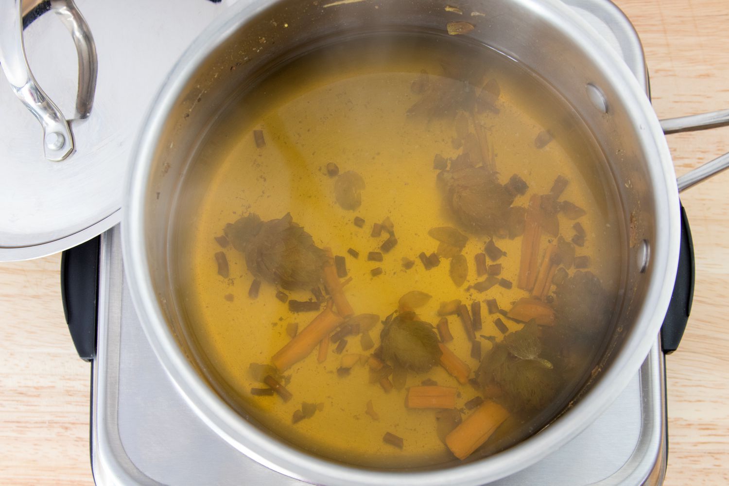 Quassia Bark, Hops, and Dandelion Root Boiling for Homemade Tonic Syrup