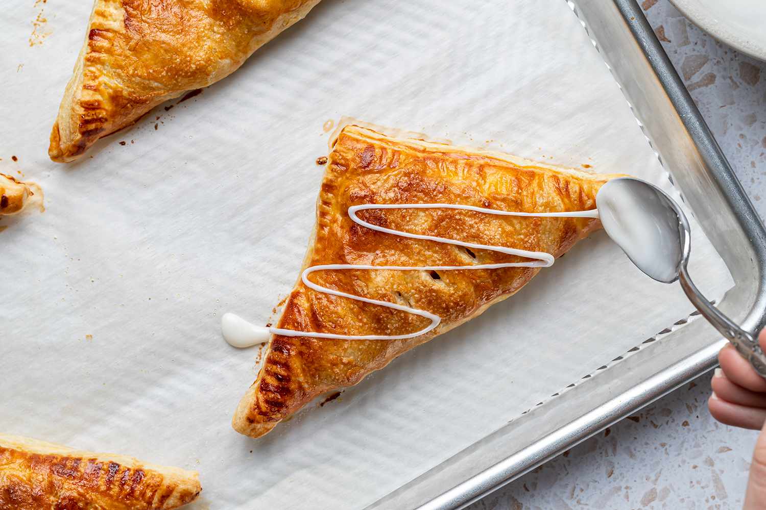 apple turnovers drizzled with glaze