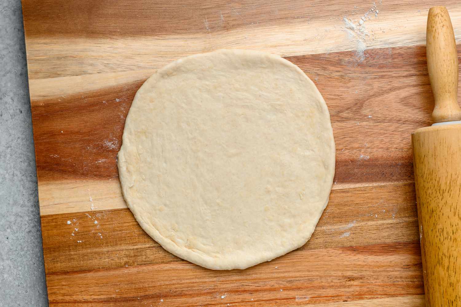 A flat, round piece of dough with a rolling pin