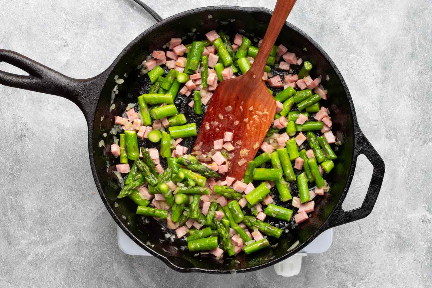cooking the asparagus and ham for an easy frittata