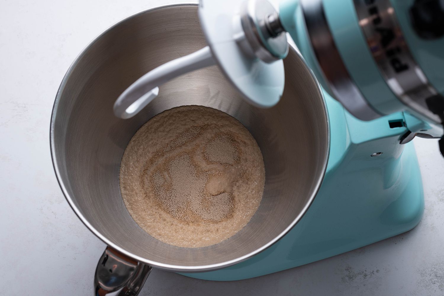 Honey, water and yeast in a stand mixer 