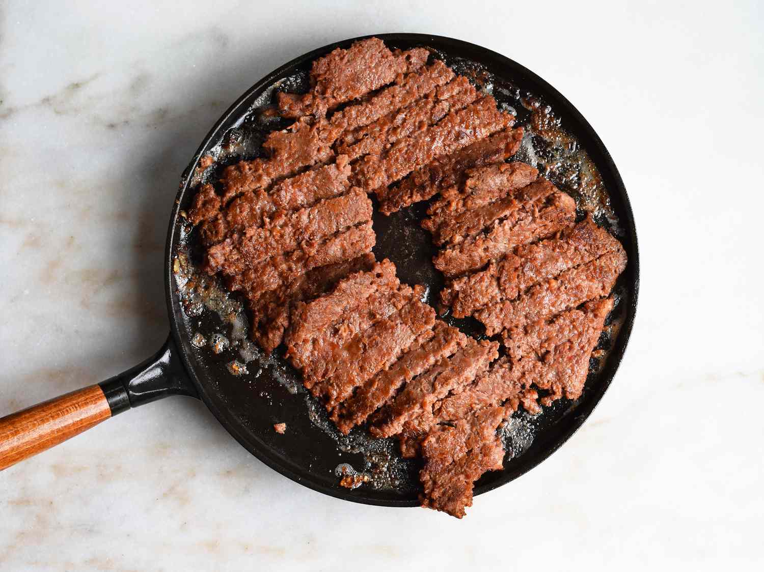 beyond meat cooked on a saute pan