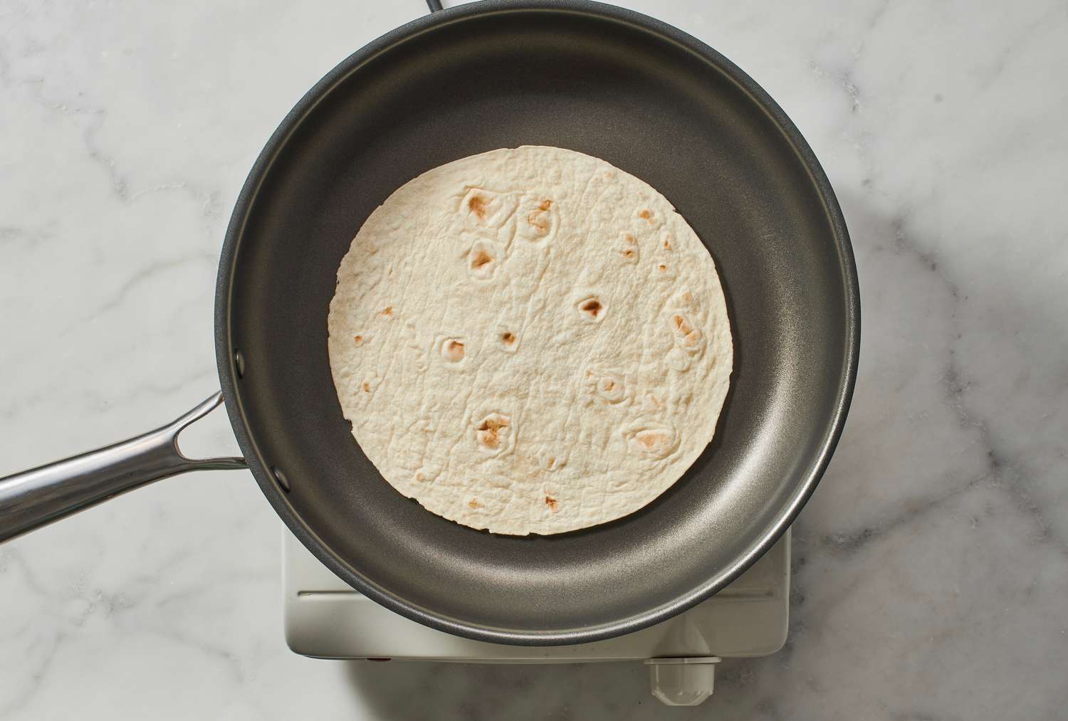 A tortilla in a skillet