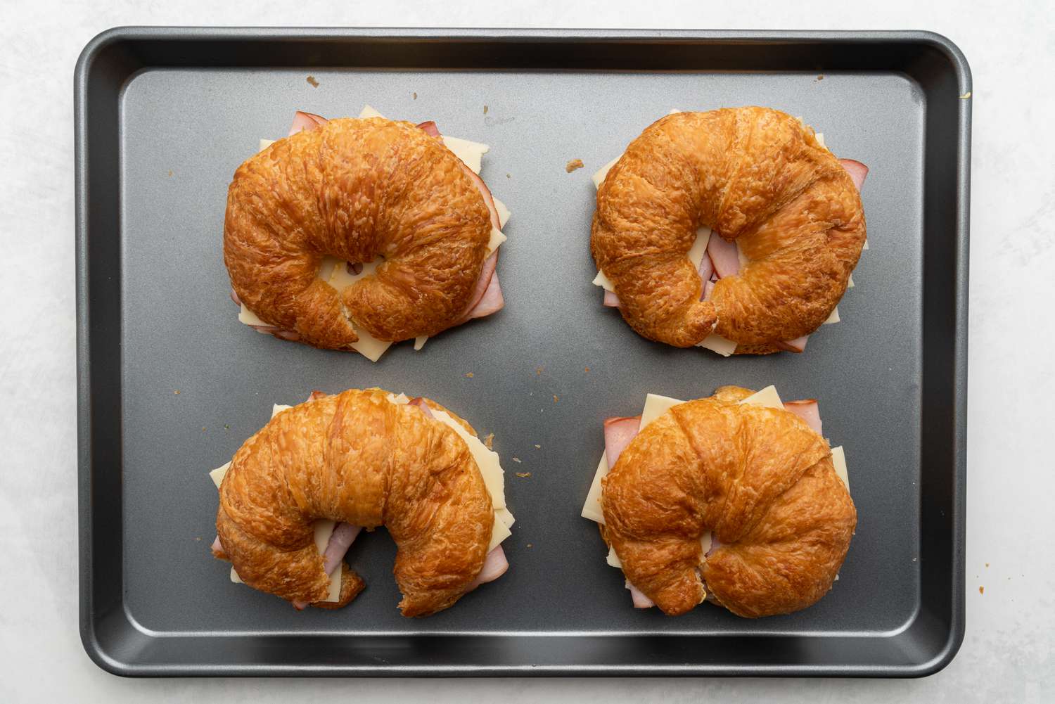 Ham and Cheese Croissants on a baking sheet before baking