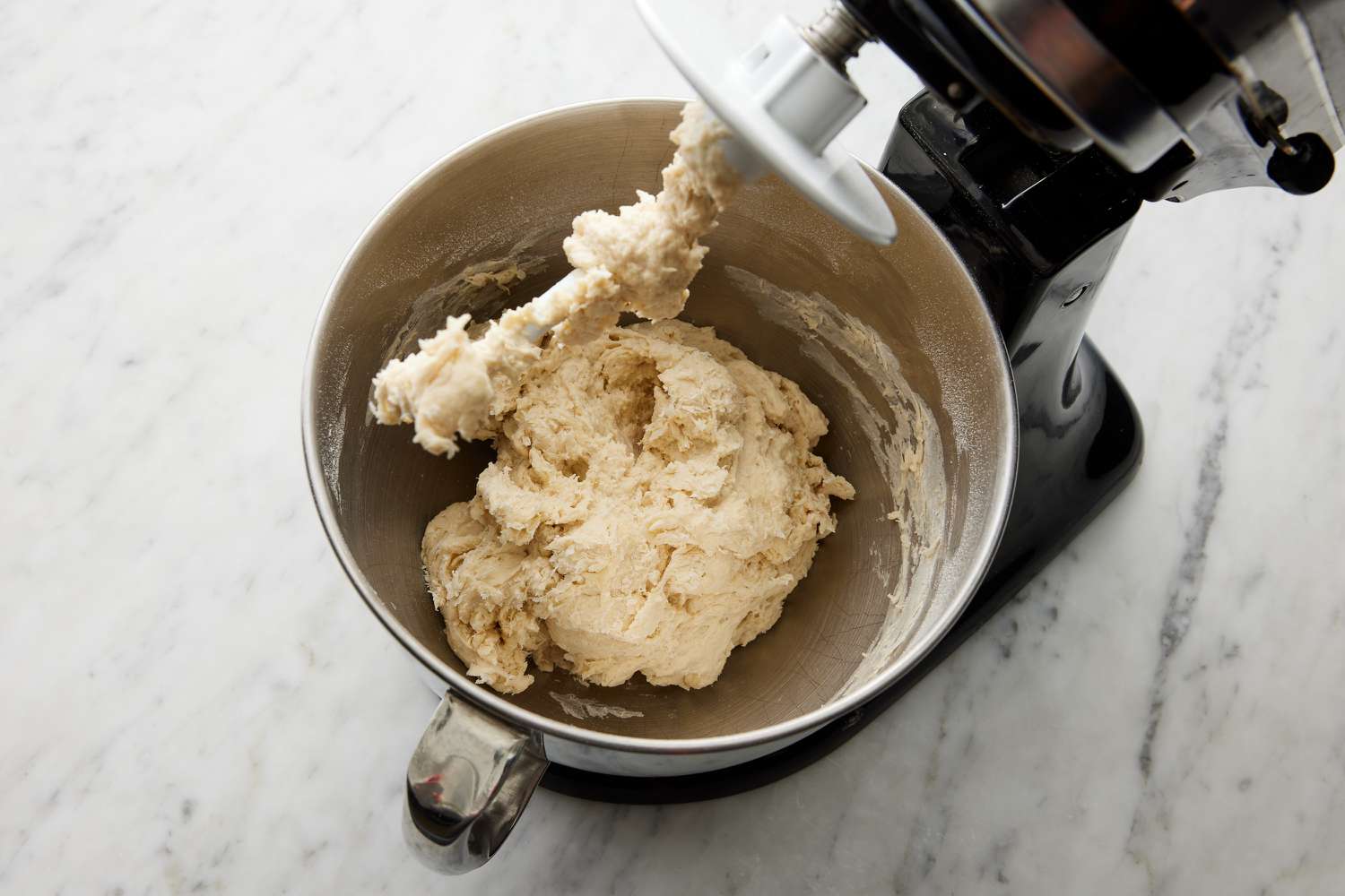 calzone dough blended in stand mixer with dough hook