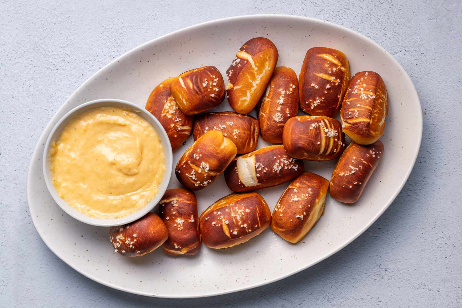 Soft pretzel bites served with cheese sauce