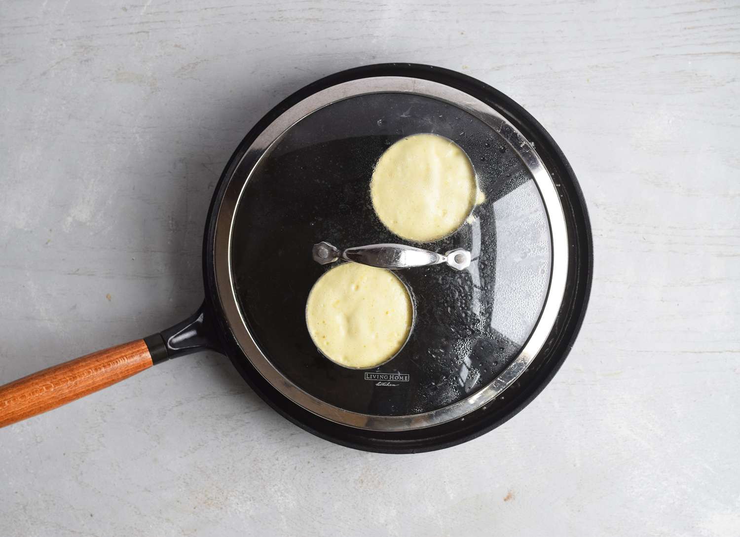 Japanese pancakes cooking on a skillet