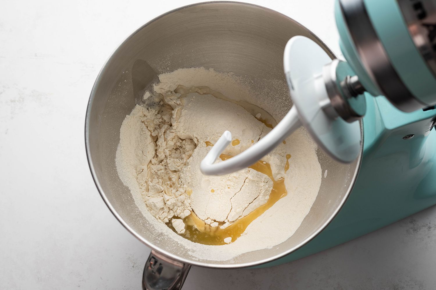 Yeast, flour, water, olive oil, and salt in a stand mixer 