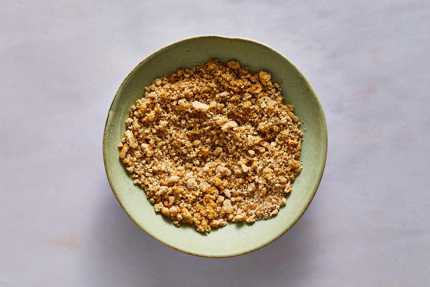 A bowl of breadcrumbs tossed with melted butter