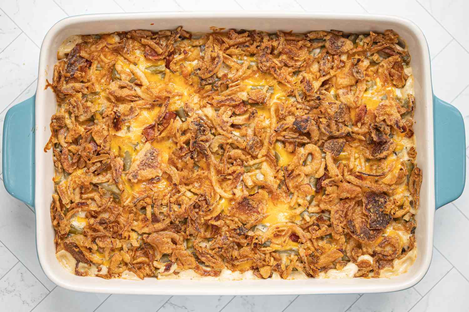 baked cheddar and bacon green bean casserole with french fried onion topping
