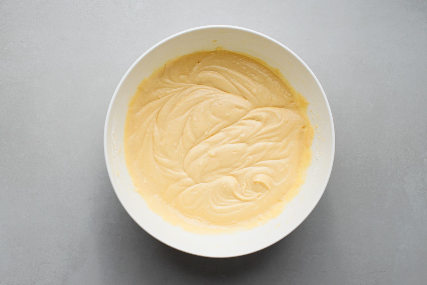 Kentucky butter cake batter mixed in a white bowl