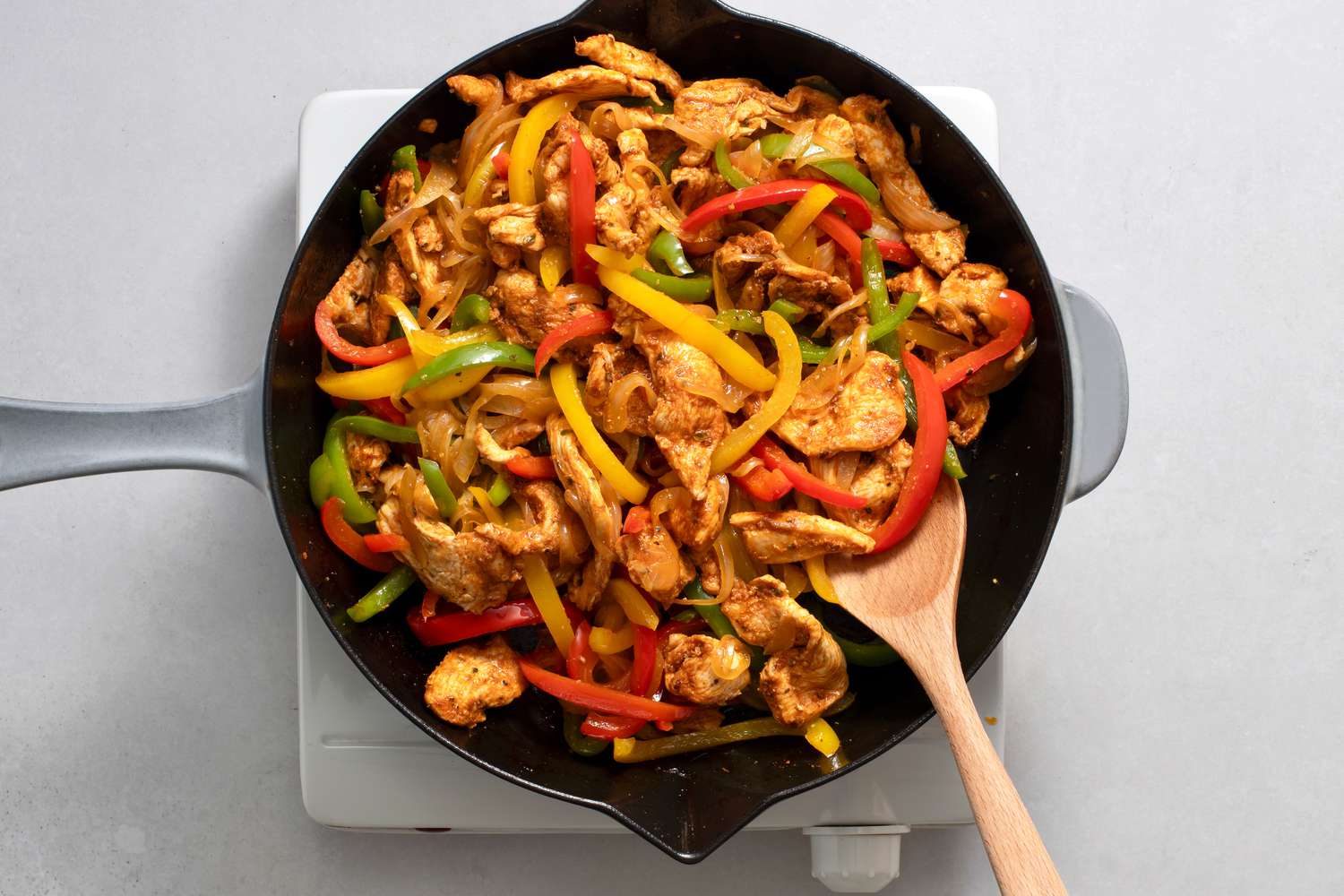 chicken and peppers in a cast iron skillet