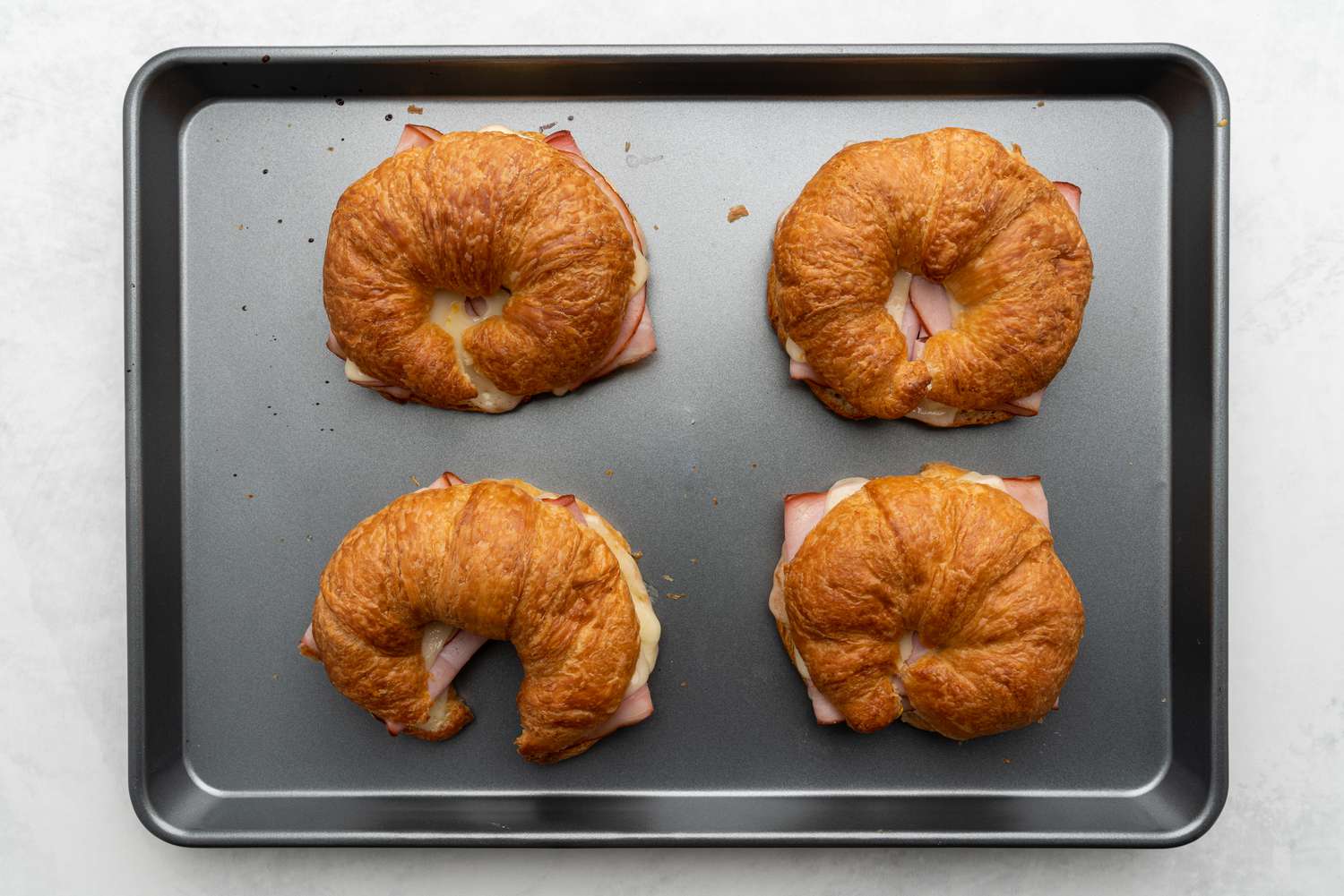 Ham and Cheese Croissants on a baking sheet