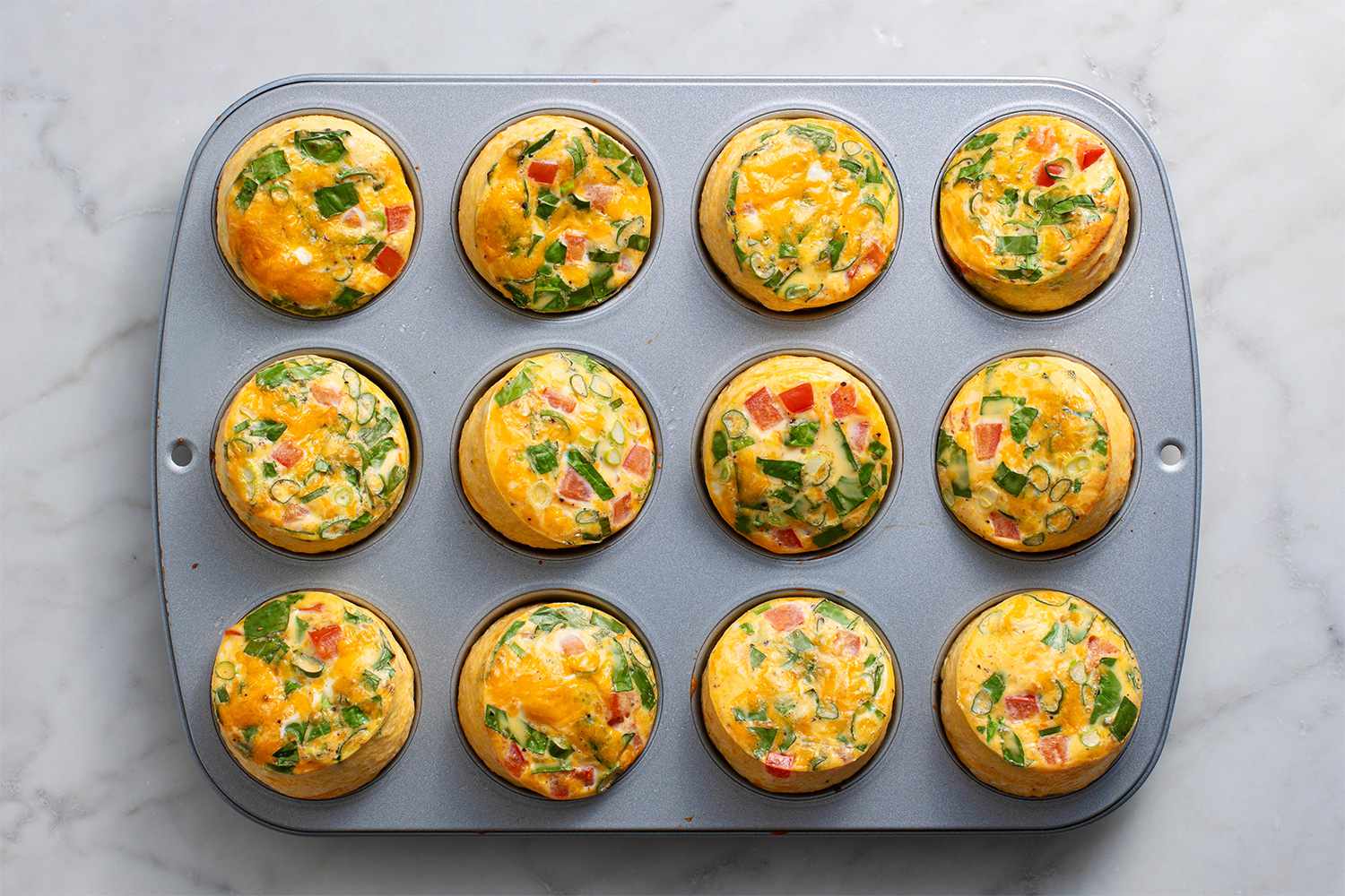 Puffy easy oven egg bites cooked in muffin tins