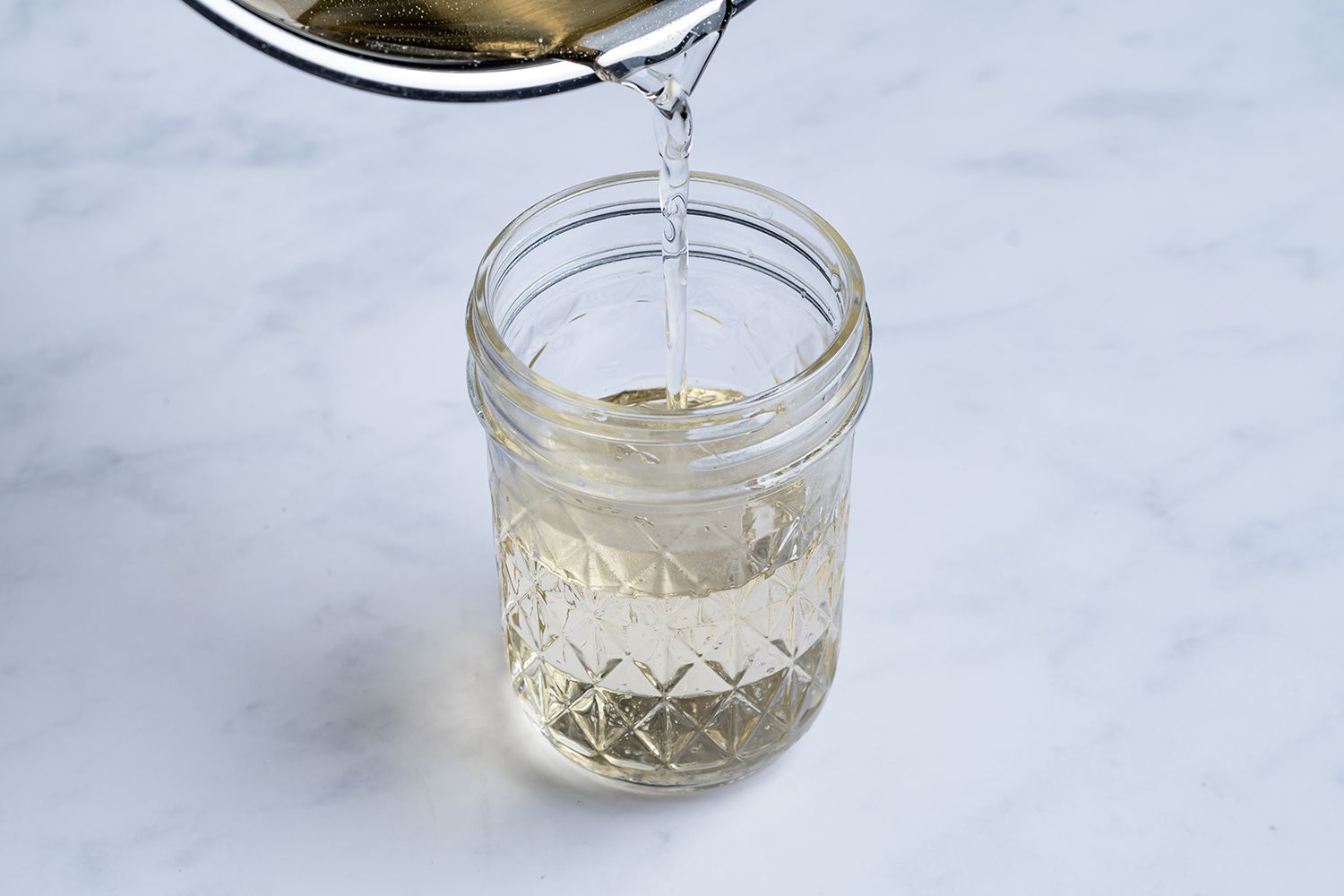 Rich Simple Syrup poured into a jar 