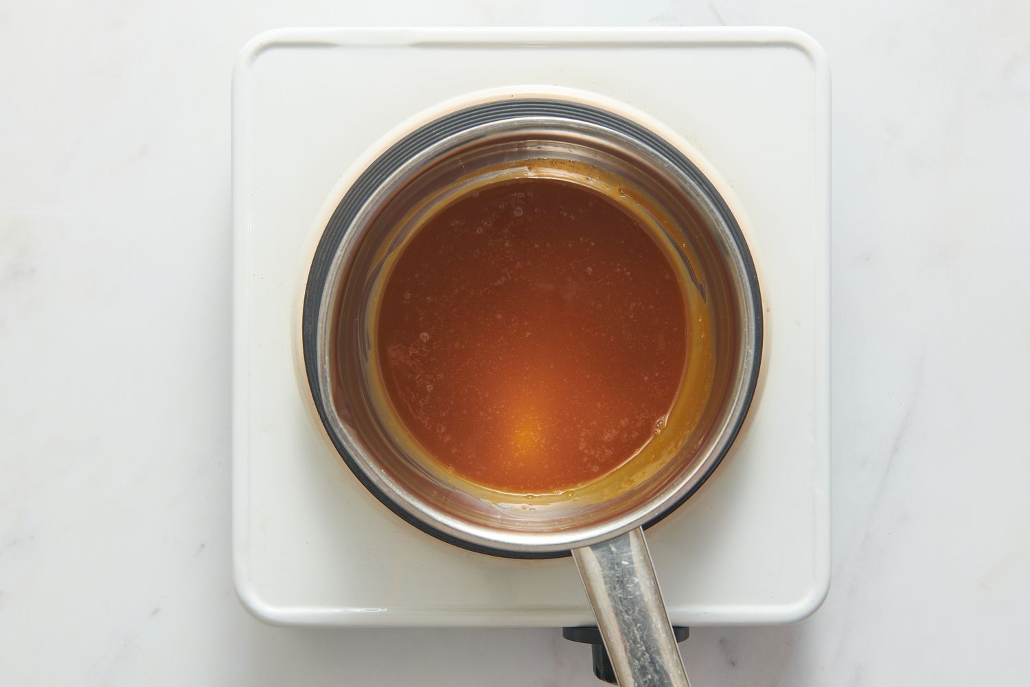 A small pot of caramel-miso sauce