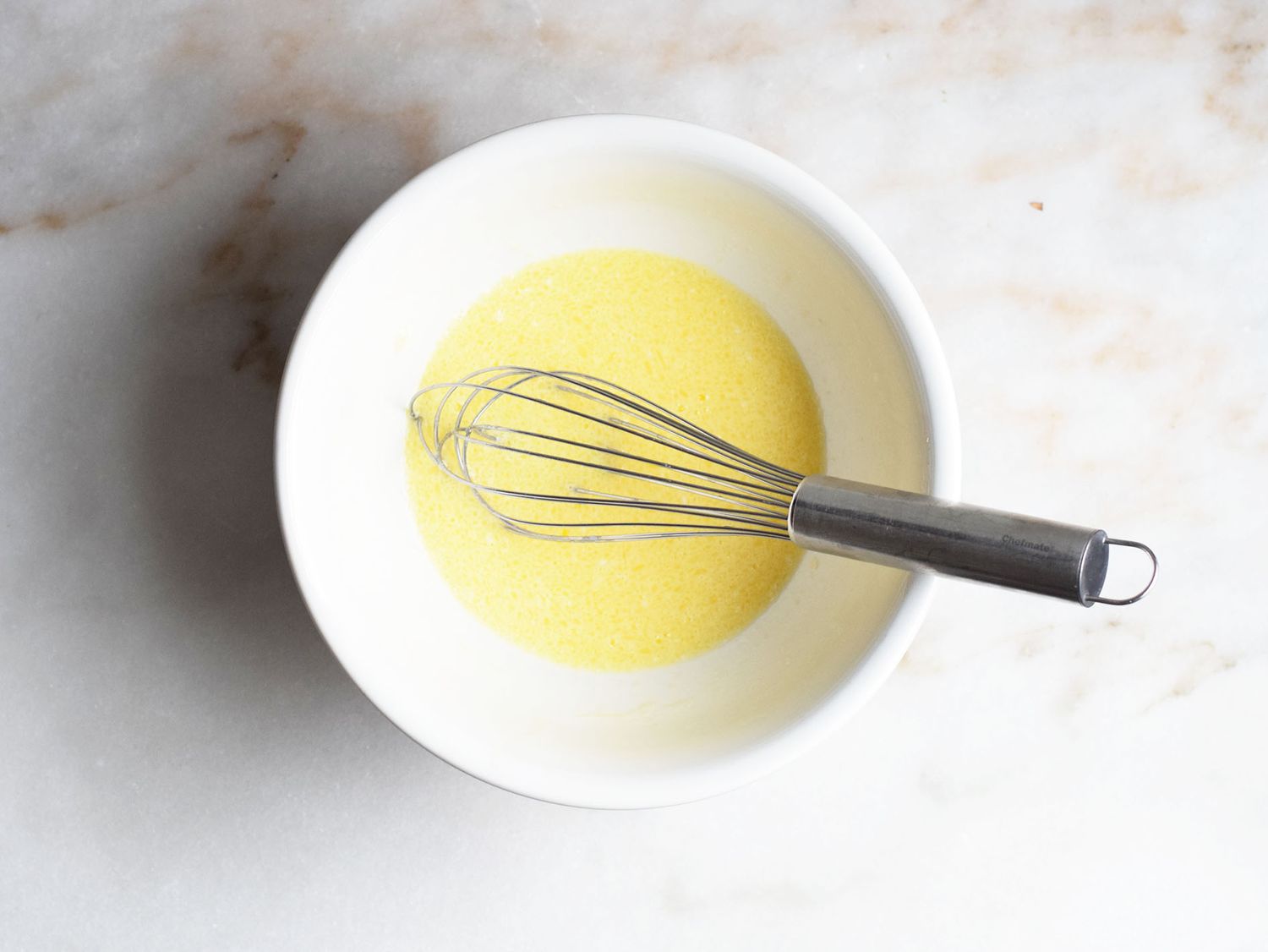 air fryer cornbread batter whisked in a bowl