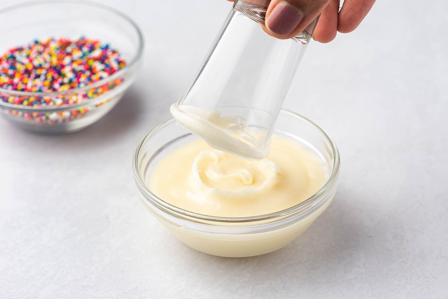 dipping shot glass in frosting