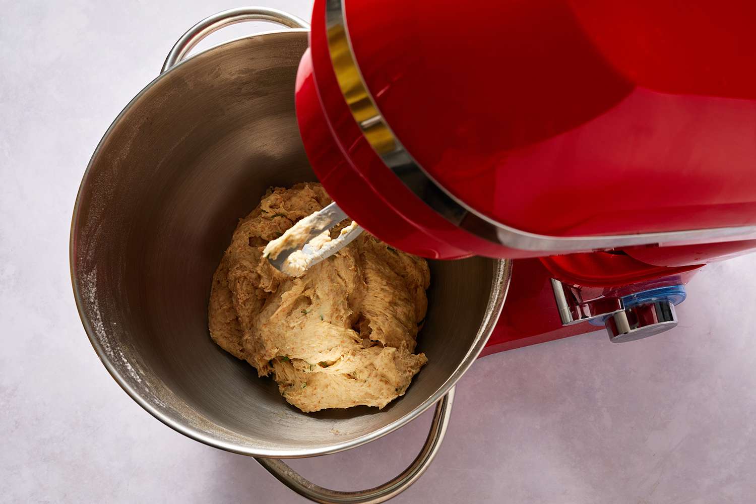 Dough in a red stand mixer 
