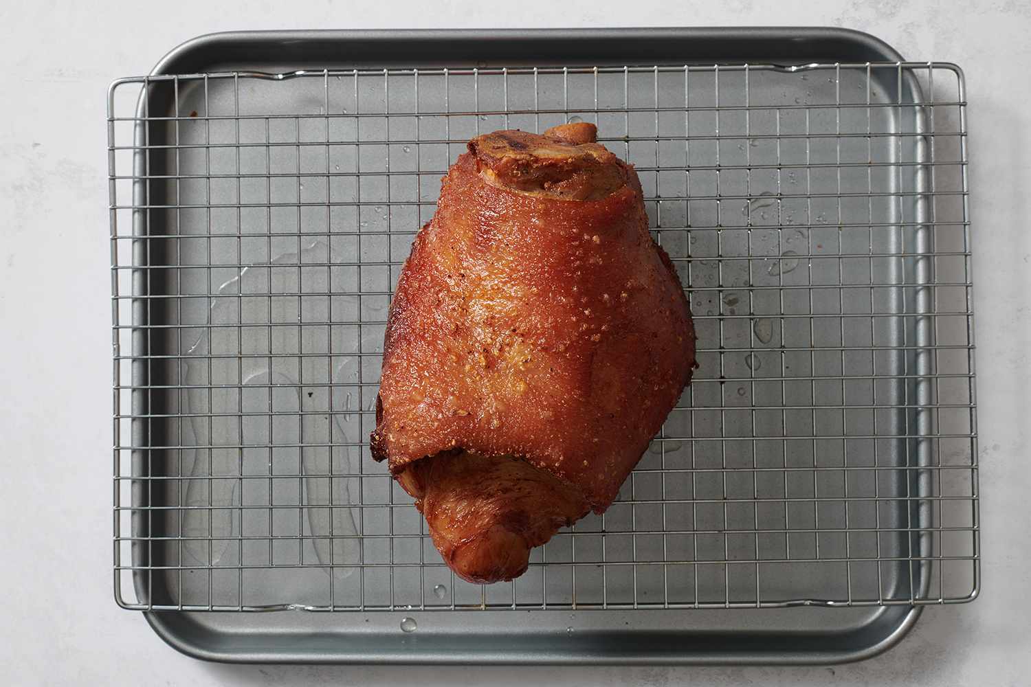 Fried ham hock on a cooling rack