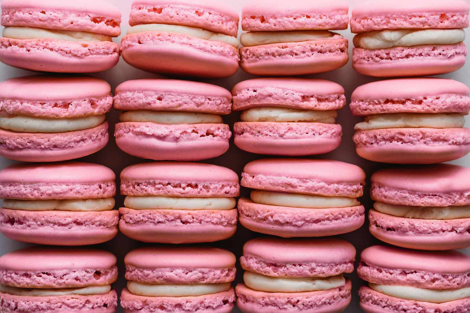 An overhead of rows of Macarons lined up next to each other 